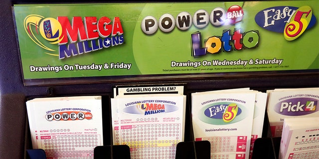 Lottery forms for Louisiana Mega Millions, Powerball and other lottery games fill the drawer at The World Bar and Grill, in Delta, La.